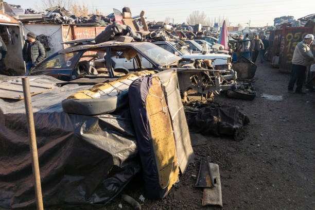 car parts at open air junkyard and used spare parts market in Kudaybergen, Bishkek, Kyrgyzstan - November 13, 2022